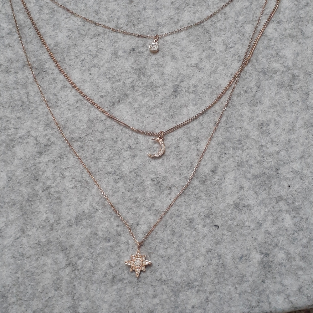Sun - Moon - Star necklace in goldtone